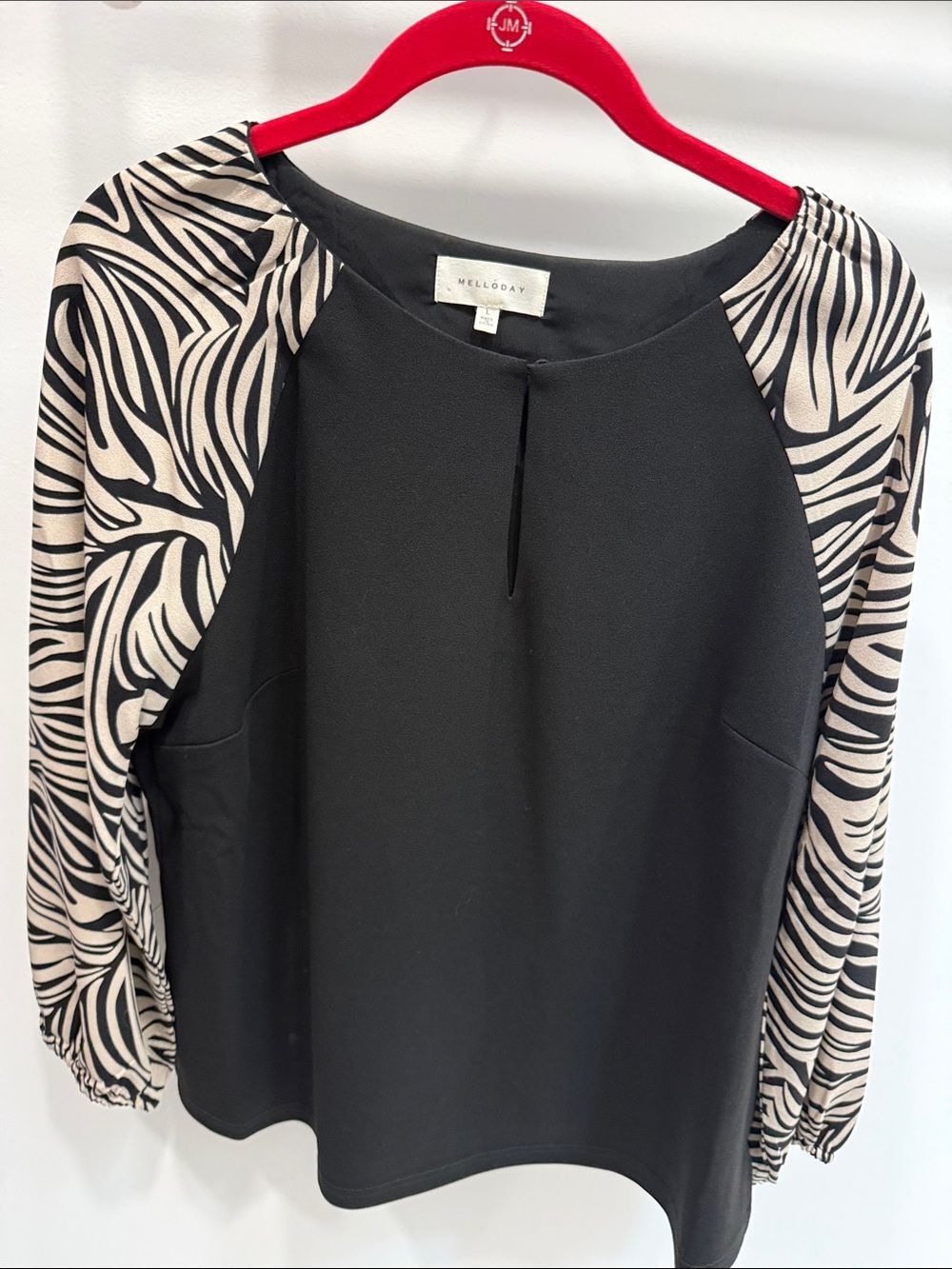 MELLODAY Black Blouse with Beige Zebra-Print Sleeves